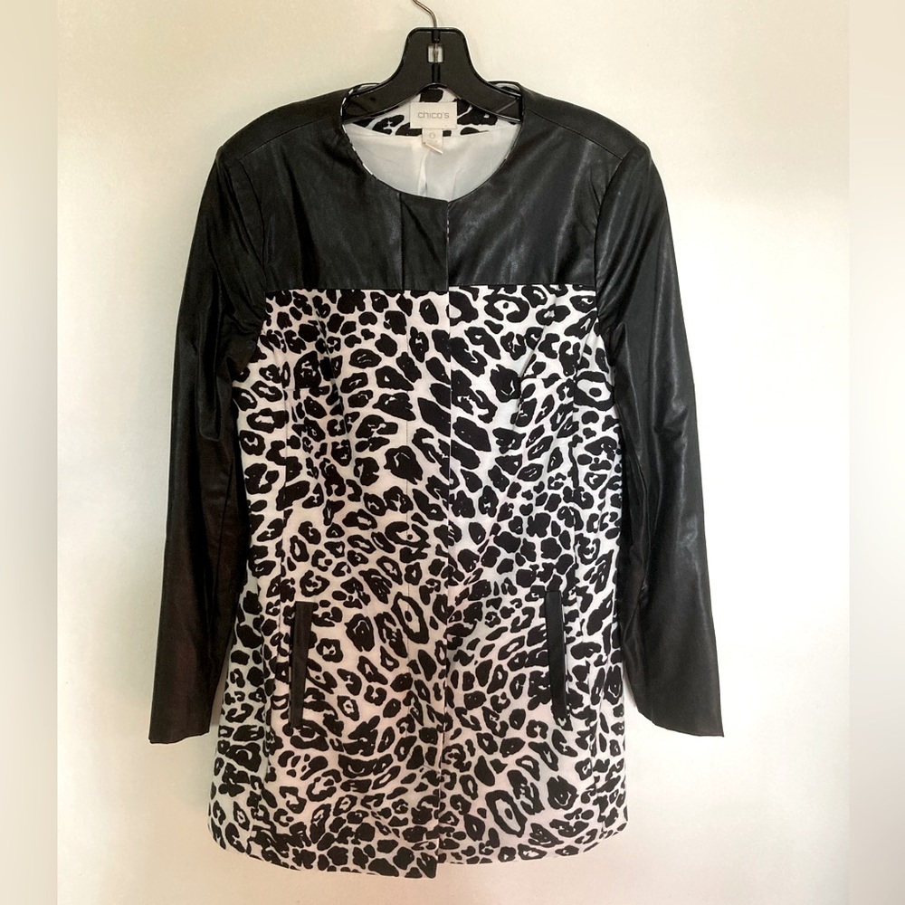 Black and white leather trimmed coat.